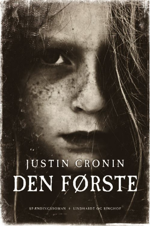 Omslag: Den første
