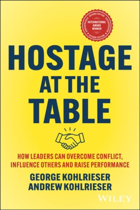 Omslag: Hostage at the Table